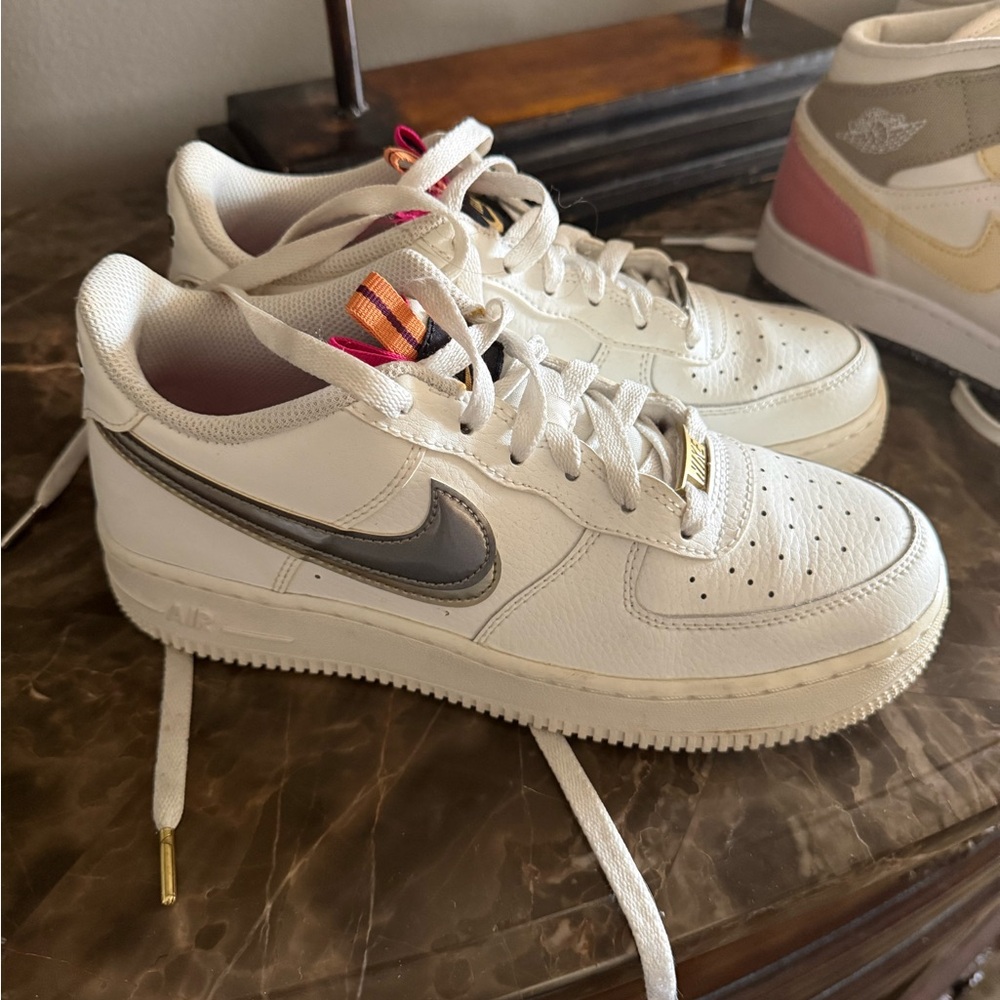 Nike White and Gray Sneakers with Gold Accents